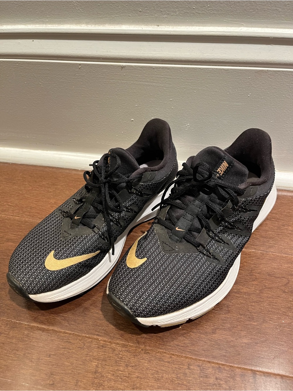 Nike Women's Athletic Shoes - Black with Gold Swoosh size 6